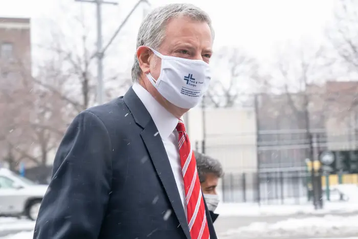 Mayor Bill de Blasio arrives to help distribute bags with Asian food during Lunar New Year celebration at Elmhurst Hospital, February 19, 2021.